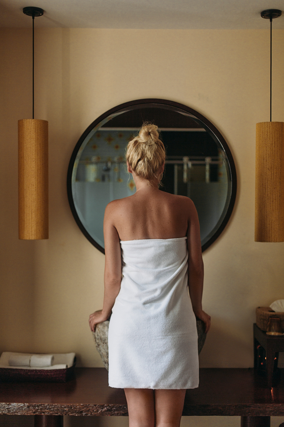 Woman Standing in Front of the Mirror in the Morning