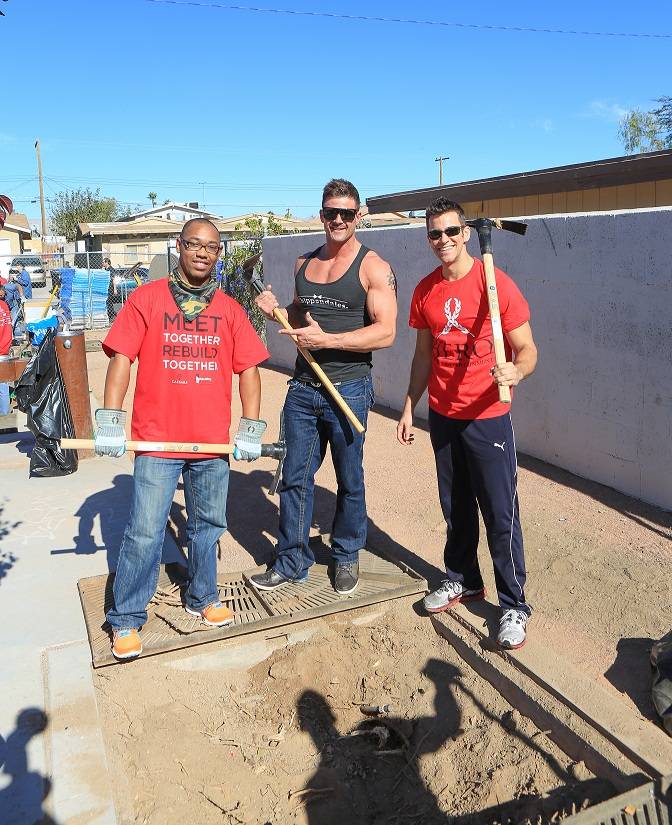 Nathan Minor of Chippendales and The Quad headliner Jeff Civillico help landscape a North Las Vegas community park . 