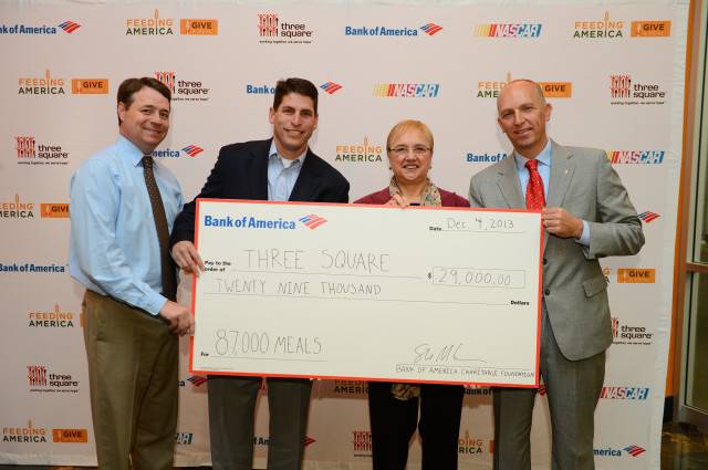 From left: Matt Muldoon (Chief Development Officer, Three Square Food Bank), Lou Garate (Senior Director, NASCAR), Lidia Bastianich and Steve McCracken (Senior Vice President, Bank of America) pose with the Bank of America Charitable Trust's $29,000 donation to Three Square. 