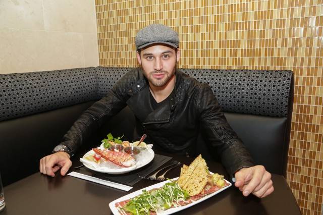 Ryan Guzman dines on a shellfish platter and New York sirloin carpaccio at N9NE Steakhouse. Photos: Edison Graff 