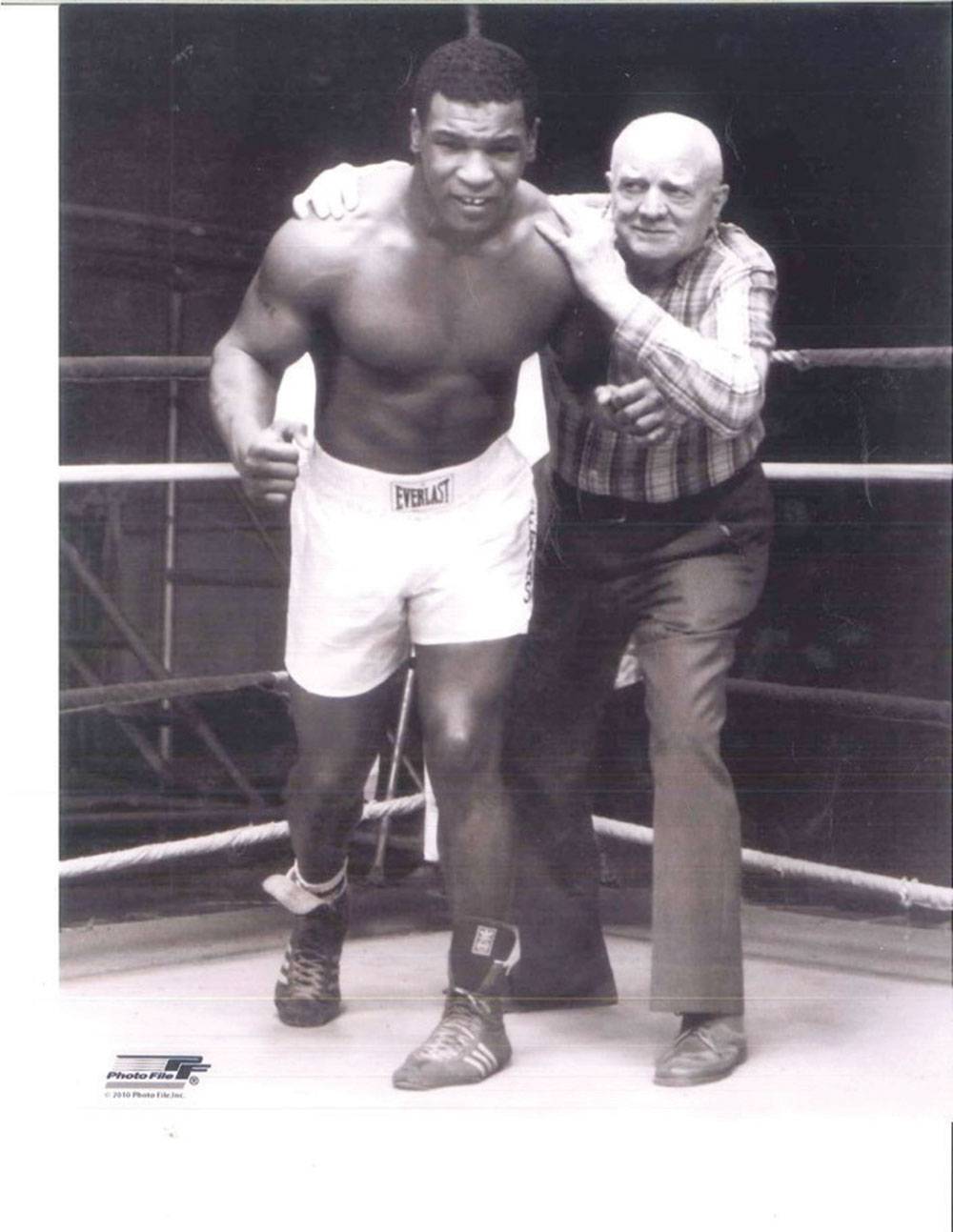 Tyson (age 17) with his boxing trainer and mentor, Cus D’Amato