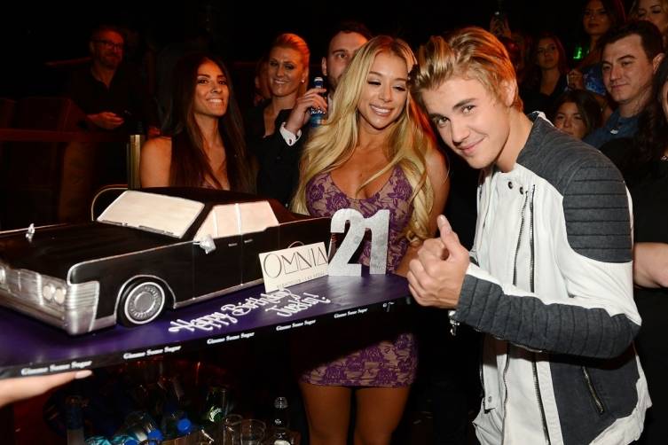 Justin Bieber with his birthday cake. 