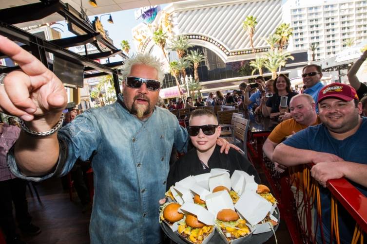 Guy Fieri and a young culinary protégé celebrate the one year anniversary of Guy Fieri’s Vegas Kitchen & Bar at The Linq.