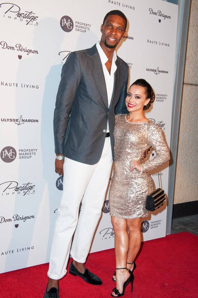 Basketball player Chris Bosh and his wife Adrienne Bosh attend Haute Living Haute 100 Dinner presented by Dom Perignon at Tamarina at Brickell World Plaza on May 6, 2015 in Miami, Florida.  (Photo by Sergi Alexander/Getty Images for Haute Living)