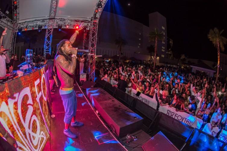 Lil Wayne performs to a packed crowd at the hottest After Dark party in Vegas inside Foxtail Pool Club