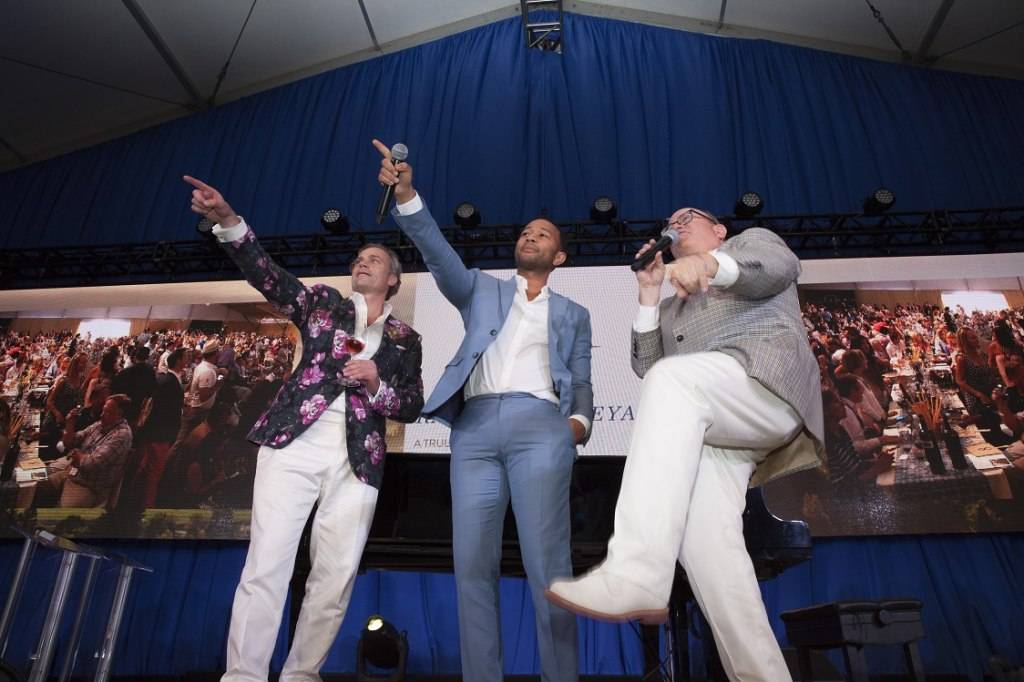 John Legend joins auctioneer Fritz Hatton auction off Lot Number 31 at Auction Napa Valley 2015. Photo by Jason Tinacci