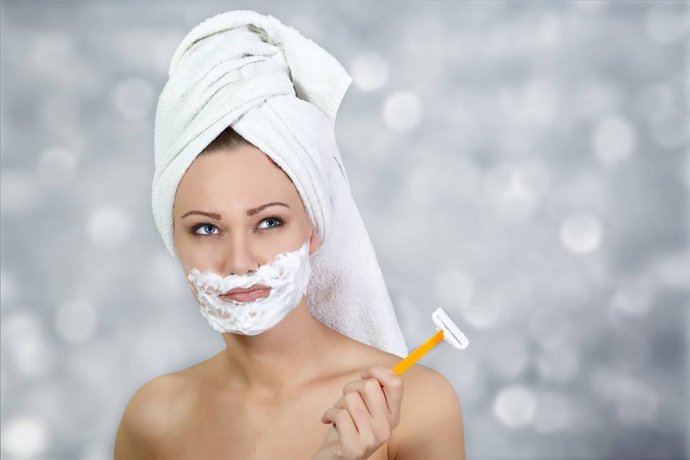 shaving facial hair female with razor