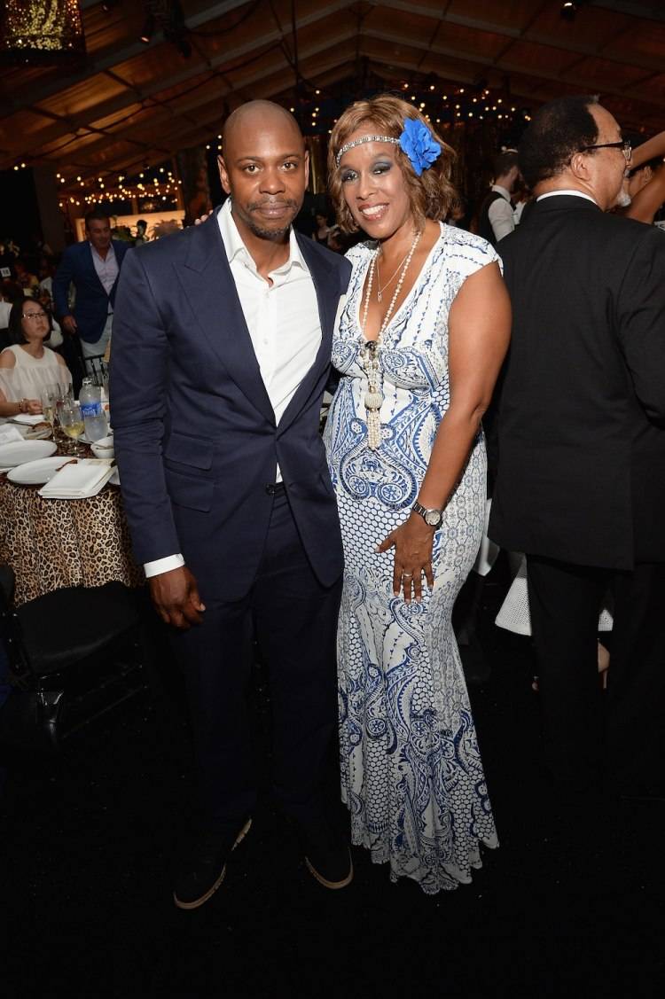WATER MILL, NY - JULY 18:  Dave Chappelle and Gayle King attend as Russell Simmons' Rush Philanthropic Arts Foundation Celebrates 20th Anniversary At Annual Art For Life Benefit at Fairview Farms on July 18, 2015 in Water Mill, New York.  (Photo by Andrew Toth/Getty Images for Rush Philanthropic Arts Foundation)