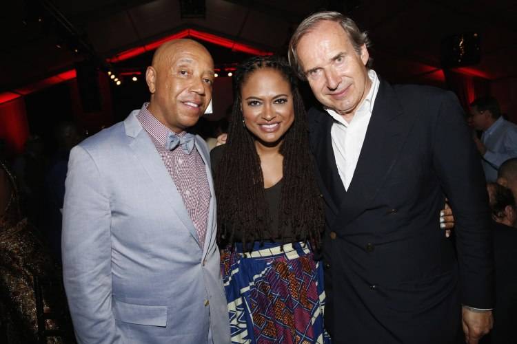 WATER MILL, NY - JULY 18:  Russell Simmons, Ava DuVernay and Simon de Pury attend as Russell Simmons' Rush Philanthropic Arts Foundation Celebrates 20th Anniversary At Annual Art For Life Benefit at Fairview Farms on July 18, 2015 in Water Mill, New York.  (Photo by Johnny Nunez/Getty Images for Rush Philanthropic Arts Foundation)