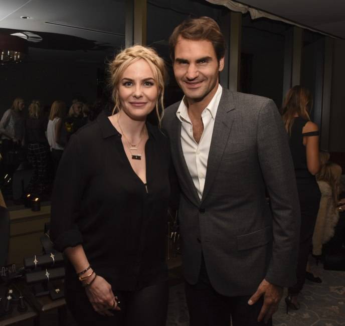 Nikki poses with Roger Federer at the launch party of her Established jewelry line in March 