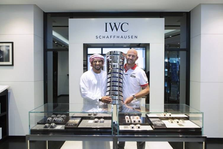 HANDOUT - Abu Dhabi, United Arab Emirates: Azzam Skipper Ian Walker (right) and teammate Adil Khalid (left) with their crew Abu Dhabi Ocean Racing (ADOR) made a final stopover at the IWC boutique in The Galleria on Al Maryah Island in Abu Dhabi, with the coveted Volvo Ocean Race trophy to celebrate the win. (PHOTOPRESS/IWC)