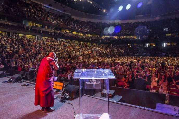 His Holiness bowing in gratitude at the sold out Honda Center crowd 