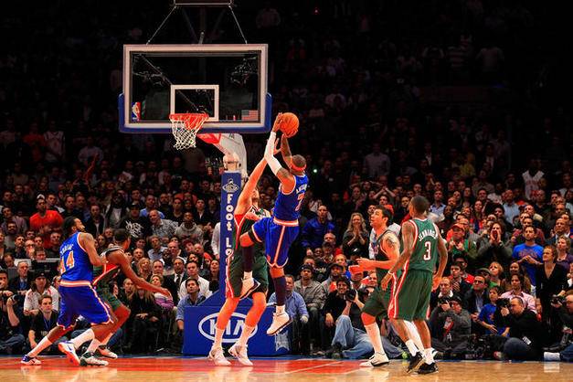 NEW YORK, NY - FEBRUARY 23:  Carmelo Anthony #7 of the New York Knicks shoots the ball over Andrew Bogut #6 of the Milwaukee Bucks at Madison Square Garden on February 23, 2011 in New York City. NOTE TO USER: User expressly acknowledges and agrees that, by downloading and/or using this Photograph, User is consenting to the terms and conditions of the Getty Images License Agreement. The Knicks defeated the Bucks 114-108.  (Photo by Chris Trotman/Getty Images) *** Local Caption *** Carmelo Anthony;Andrew Bogut