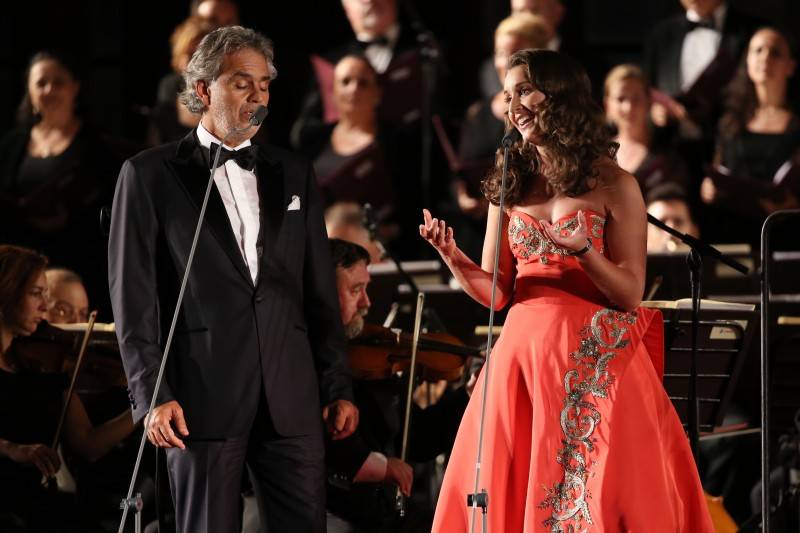 Singers Andrea Bocelli and Carly Paoli perform at the Celebrity Fight Night gala at Palazzo Vecchio 