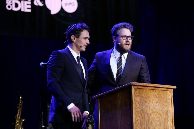 James Franco (L) and Hilarity for Charity co-founder/show host Seth Rogen perform onstage during Hilarity for Charity's annual variety show: James Franco's Bar Mitzvah, benefiting the Alzheimer's Association, presented by Funny or Die, go90 and SVEDKA Vodka at the Hollywood Palladium on October 17, 2015 