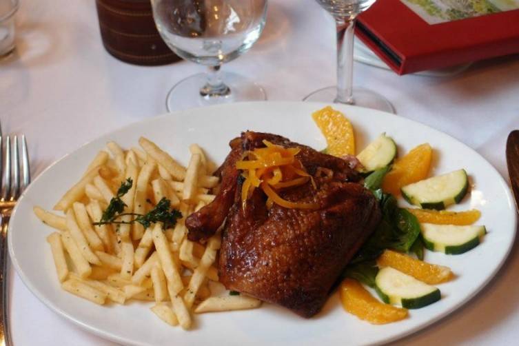 Classic French dishes like this beautiful duck are plated with creative attention to detail.