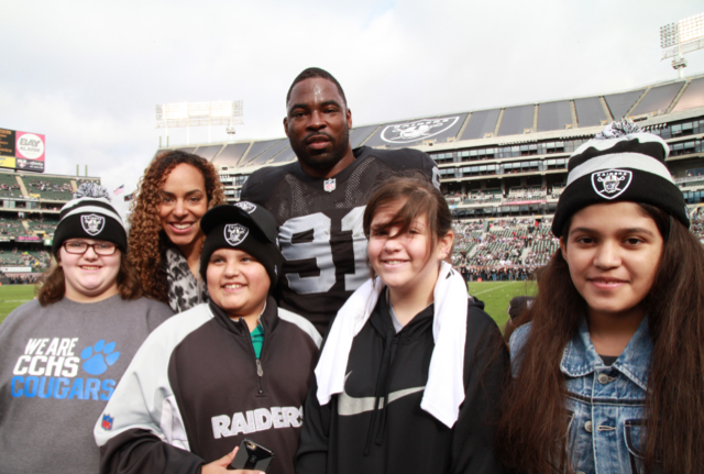 Lauran Tuck, Justin Tuck and Bay Area Tuck’s R.U.S.H. for Literacy students