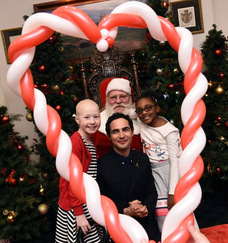 NEW YORK, NY - DECEMBER 16: Zac Posen poses with St. Jude's patient children Kenlie and Marcelle, and Santa at Brooks Brothers holiday celebration with St. Jude Children's Research Hospital Brooks Brothers Madison Avenue Flagship on December 16, 2015 in New York City. (Photo by Ilya S. Savenok/Getty Images for Brooks Brothers)