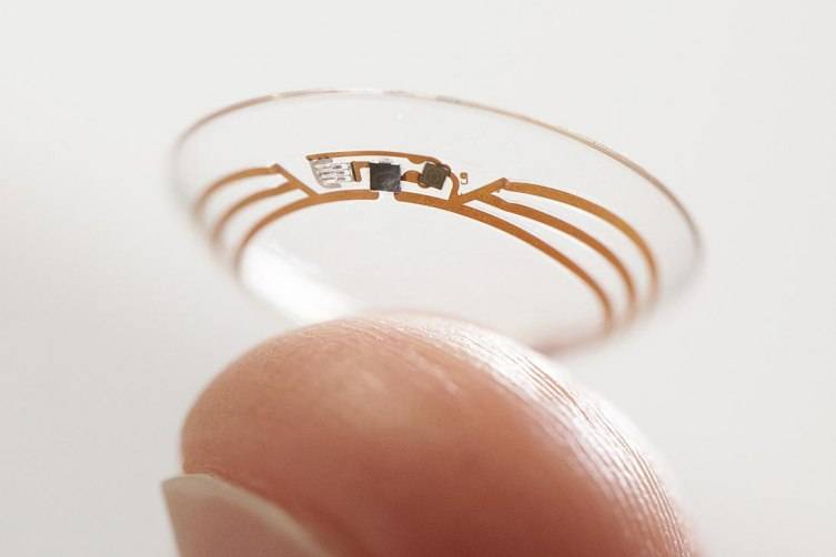 This undated photo released by Google shows a contact lens Google is testing to explore tear glucose. After years of scalding soldering hair-thin wires to miniaturize electronics, Brian Otis, Google X project lead, has burned his fingertips so often that he can no longer feel the tiny chips he made from scratch in Googles Silicon Valley headquarters, a small price to pay for what he says is the smallest wireless glucose sensor that has ever been made. (AP Photo/Google)