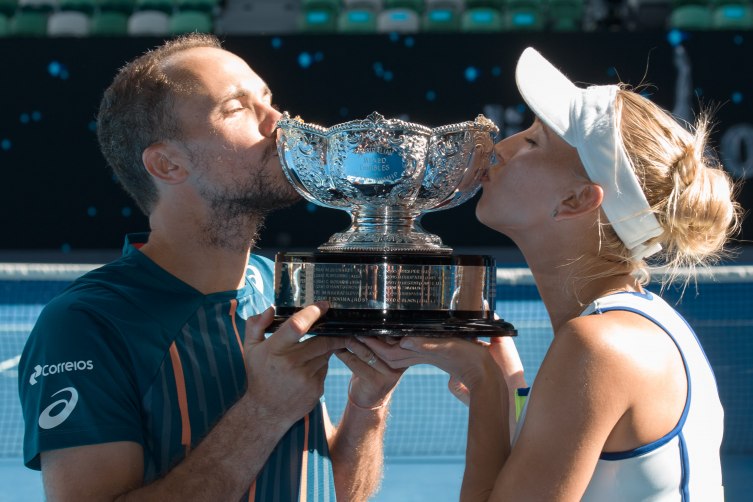 January 31, 2016: Elena Vesnina of Russian Federation and Bruno Soares of Brazil pose for photos after winning the Mixed Doubles Final against Coco Vandeweghe of United States of America and Horia Tecau of Romania on day fourteen of the 2016 Australian Open Grand Slam tennis tournament at Melbourne Park in Melbourne, Australia. 