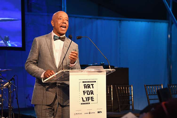 CEO of Rush Communications Russell Simmons speaks onstage during Rush Philanthropic Arts Foundation's 2016 ART FOR LIFE Benefit at Fairview Farms on July 16, 2016 in Bridgehampton, New York. (Photo by Nicholas Hunt/Getty Images for Rush Philanthropic Arts Foundation)