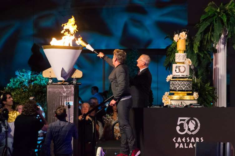 Gordon Ramsay lights the celebratory cauldron at Caesars Palace. 