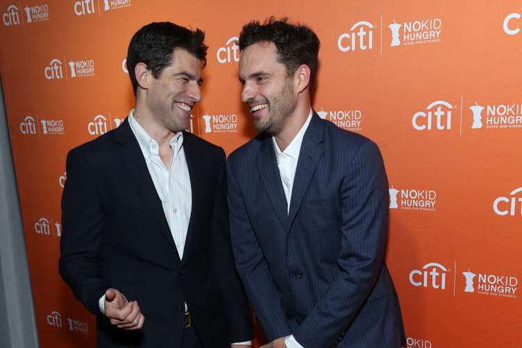 Max Greenfield and Jake Johnson share a moment at the annual No Kid Hungry dinner 