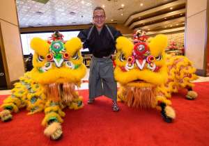 Chef Masaharu Morimoto with lion dancers