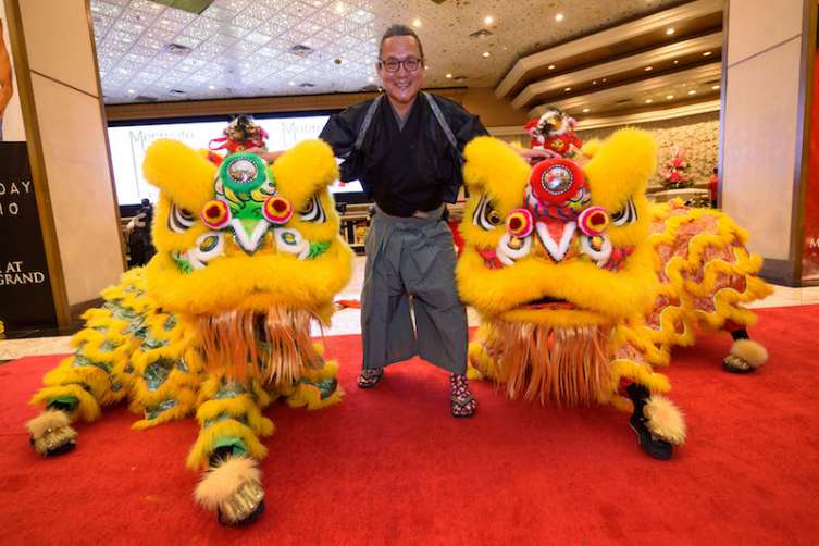 Chef Masaharu Morimoto with lion dancers