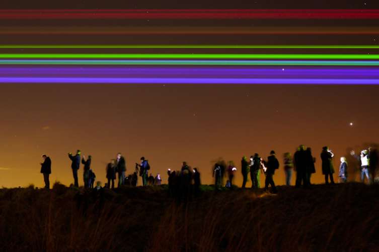 'Global Rainbow' by American artist Yvette Mattern, Saint Mary's Lighthouse, Whitley Bay, Tyne and wear UK. 2/3 2012. The work can be seen until the evening of Sunday 4/3 2012 from 6:00pm till midnight. From the press release: Yvette Mattern’s stunning laser rainbow projection – Global Rainbow – will continue to shine along the North Tyneside coastline over the next four evenings until March 4 to mark the launch of 2012’s Cultural Olympiad programme in the region. Wednesday 29 February, 18.00 – midnight Thursday 1 March, 18.00 – midnight Friday 2 March, 18.00 – midnight Saturday 3 March, 18.00 – midnight Sunday 4 March, 18.00 - midnight Global Rainbow is a large scale, spectacular outdoor laser projection created by American artist, Yvette Mattern. It consists of seven parallel beams of high specification laser light, representing the spectrum of the traditional seven colours of the rainbow, and is designed to be projected across large open sites, particularly densely populated areas. With the installation, the artist intends to encompass geographical and social diversity in its reach and to symbolise hope. Launching the North East’s Cultural Olympiad programme for 2012 on Leap Day, Wednesday 29 February, Global Rainbow was projected last night from St. Mary’s headland along an eight kilometre stretch of the North Tyneside coastline and will be visible for the next four evenings. Global Rainbow is the first in a series of high profile Cultural Olympiad projects taking place across the North East during 2012. In this region, the North West and Northern Ireland it will form the main opening event for each region’s 2012 Cultural Olympiad programme. Global Rainbow was initially created for projection in New York City on 19 January 2009 (Martin Luther King Day) where it was projected from the pyramidal top of the 14 Wall Street skyscraper in downtown Manhattan (the former penthouse of J Paul Getty). The beams extended from Brooklyn Bridge to the east and the Hudson River to the west, passing over Ground Zero. Subsequently, it has been shown in Berlin in February 2010 where, over nine evenings, it formed the signature event for the annual Transmediale festival of media art and was seen by several million people. In October 2010 it was the signature event at La Novela Festival in Toulouse. In September 2011, it formed the signature event for the launch of the new programme season at Le Lieu Unique, the national centre for contemporary art in Nantes. Yvette Mattern is a New York and Berlin based visual artist whose work has an emphasis on video and film, which frequently intersects performance, public art and sculpture. Her work has been exhibited in Berlin, Vienna, Dakar, New York, Venice, Rome, Chicago and Amsterdam. http://yvettemattern.com Global Rainbow is funded in the North East by North Tyneside Council and Arts Council England. Supported by Lightwave International, Global Rainbow forms part of the Cultural Olympiad. Global Rainbow is produced in the UK by amino, a contemporary arts production agency based in Newcastle upon Tyne. http://amino.org.uk For media enquiries contact: Nicky Harrison PR for the London 2012 Olympic and Paralympic Games in North East England and the Host City of Newcastle Upon Tyne T. +44 (0)191 280 8020 M. +44 (0)7824 390826 Photo ©:Mark Pinder +44 (0)7768 211174 mark@markpinderphotography.co.uk