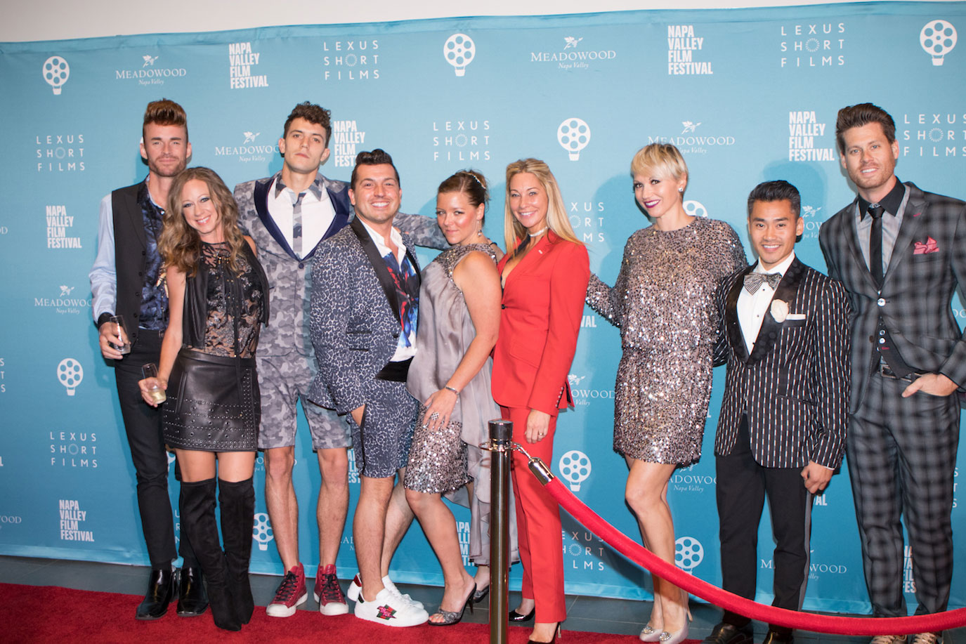 The Jake posse includes Penelope Moore, second from left, model Robert Mull, and Jake Wall; Tiffany Cummins in red pantsuit, and Nathan Johnson far right