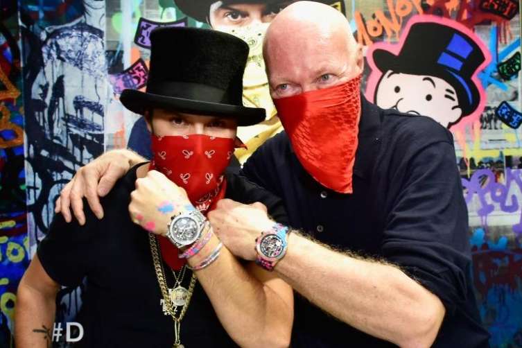 Alec Monopoly (left) with TAG Heuer CEO Jean-Claude Biver on the occasion of Alex Monopoly's appointment as the brand's Art Provocateur. 