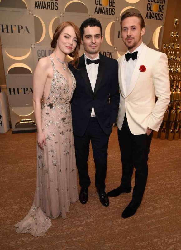 (L-R) Actress Emma Stone, director Damien Chazelle, actor Ryan Gosling attend the 74th Annual Golden Globe Awards 