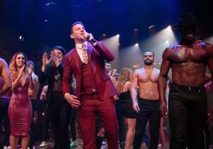 Channing Tatum talks to the crowd at the opening of "Magic Mike Live."