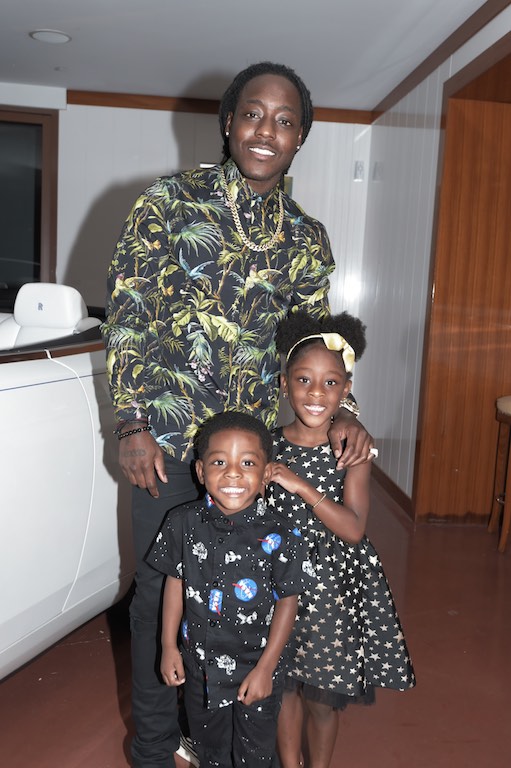 Ace Hood with children