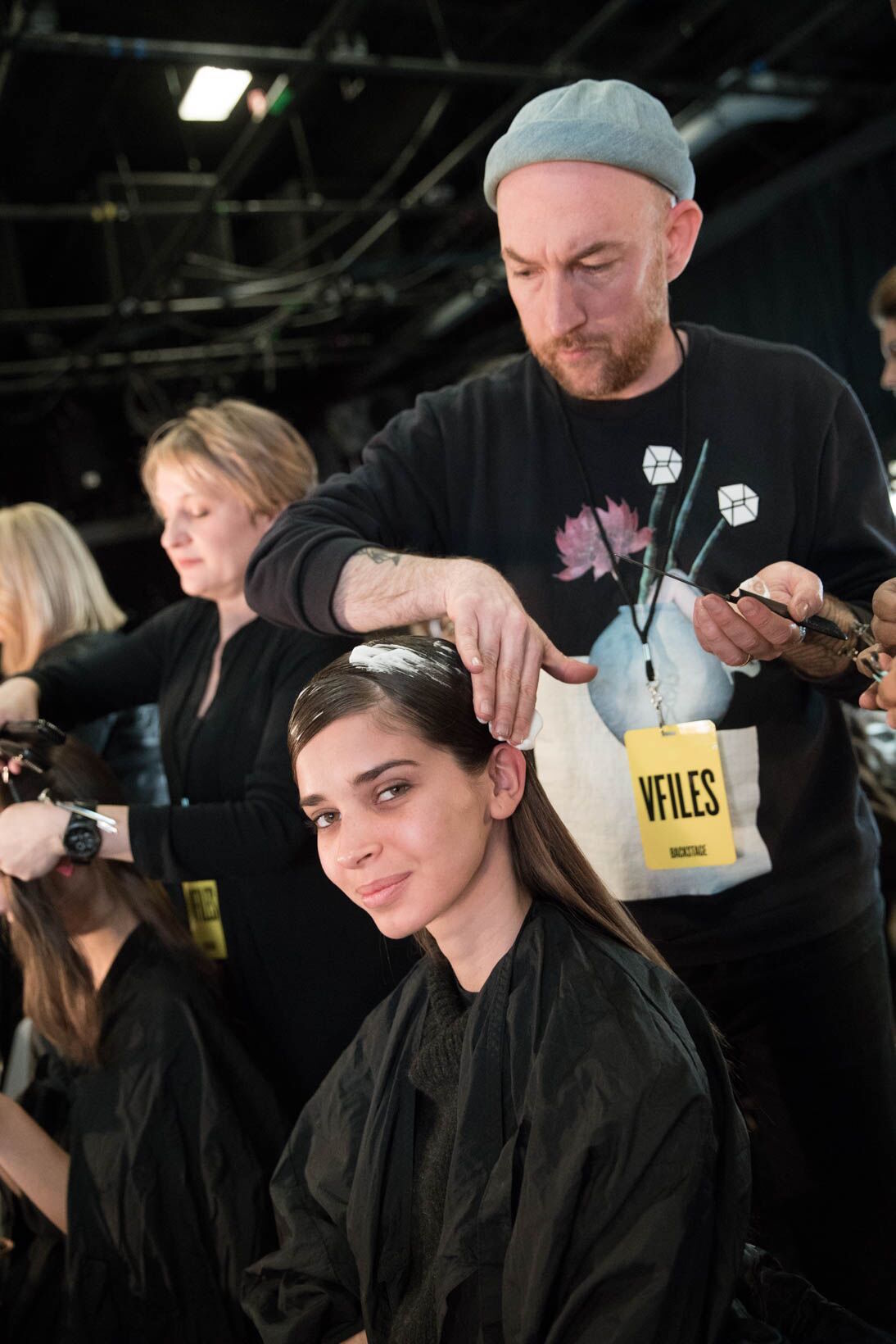 Michael Forrey does a model's hair during fashion week