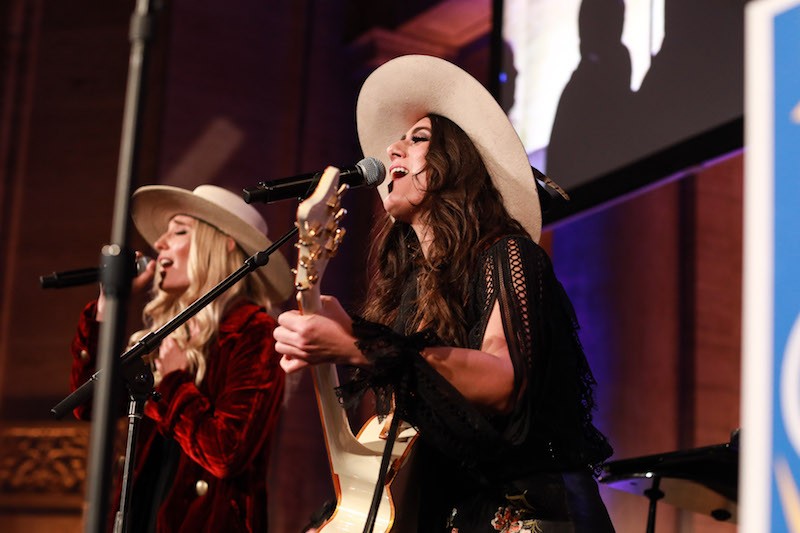 Country-rock duo The Sisterhood (Ruby Stewart and Alyssa Bonagura) perform at The Skin Cancer Foundation Champions for Change Gala.