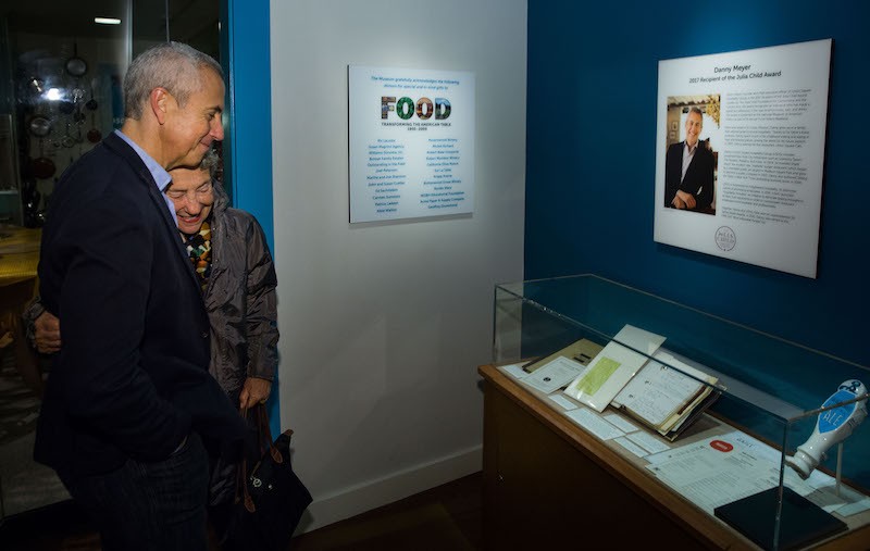 Danny Meyer and his mother viewing his contributions to the Smithsonian Food History Weekend Exhibit.