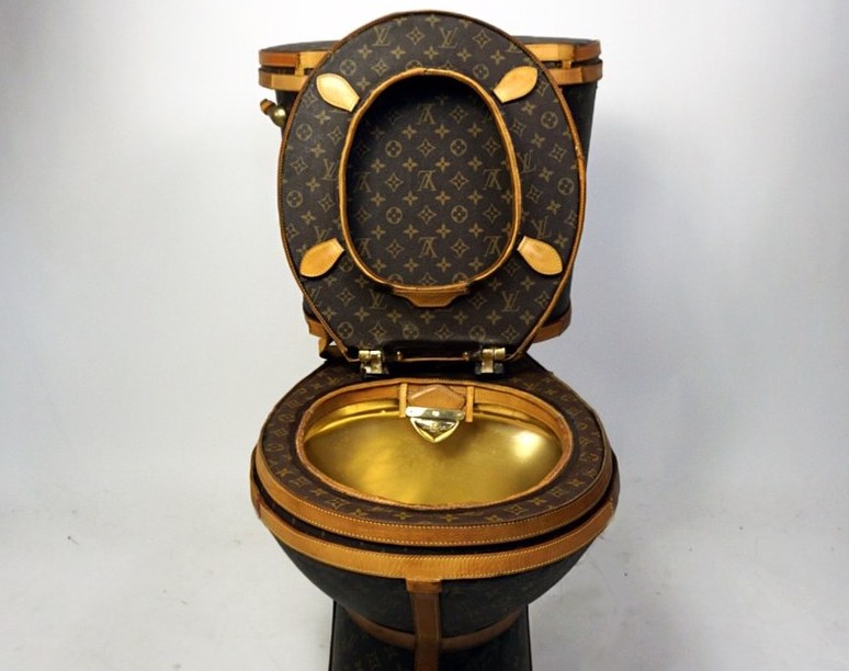 Golden toilet covered in Louis Vuitton bags put on sale for