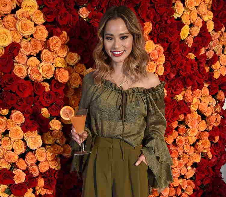 Jamie Chung poses with the signature cocktail for the 2018 Golden Globes, The Moet 75