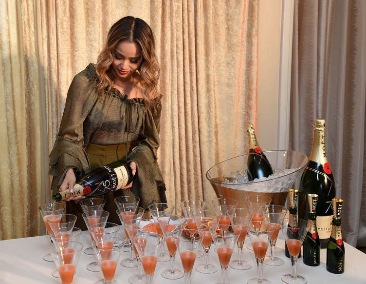 Jamie Chung prepares the signature cocktail for the 2018 Golden Globes, The Moet 75 