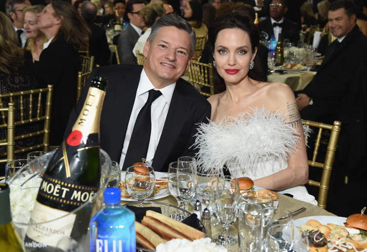 Businessman Ted Sarandos (L) and actor Angelina Jolie 