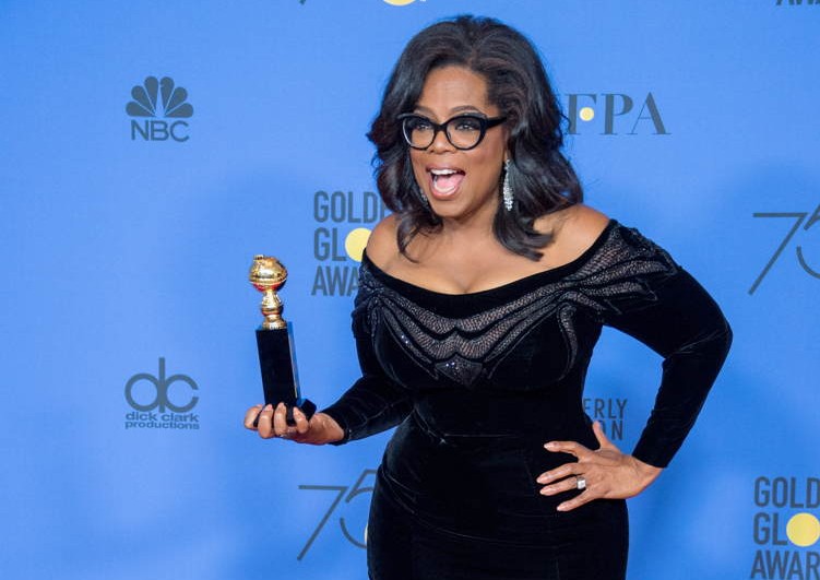 Oprah Winfrey poses backstage in the press room with the Cecil B. DeMille Award for her “outstanding contribution to the entertainment field” at the 75th Annual Golden Globe Awards at the Beverly Hilton 
