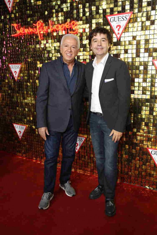 Fashion designer and co-founder of Guess? Inc. Paul Marciano (L) and Victor Herrero 
