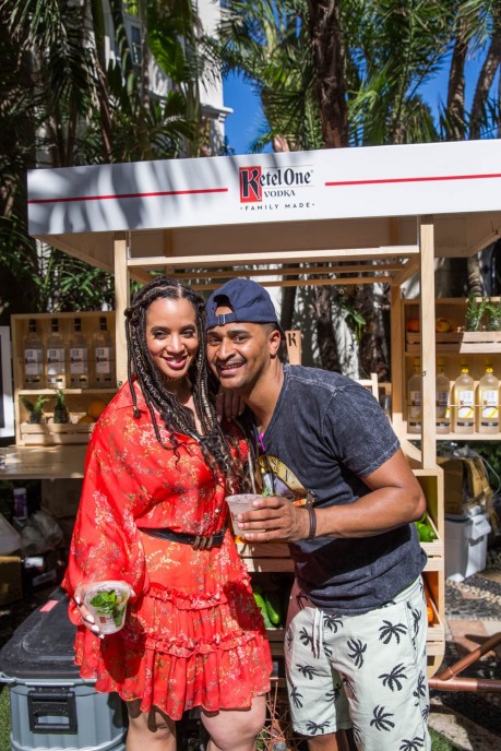 At the Ketel Market, actress Dascha Polanco and Chef JJ Johnson enjoy Ketel Soda cocktails at New Taste of South Beach hosted by Ketel One Family-Made Vodka and Wine N Dine.