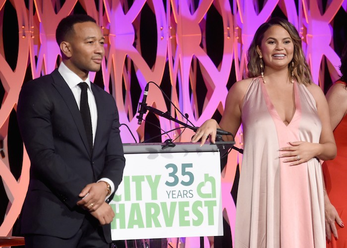 John Legend (L) and Chrissy Teigen speak onstage during City Harvest's 35th Anniversary Gala at Cipriani 42nd Street on April 24, 2018 in New York City. 