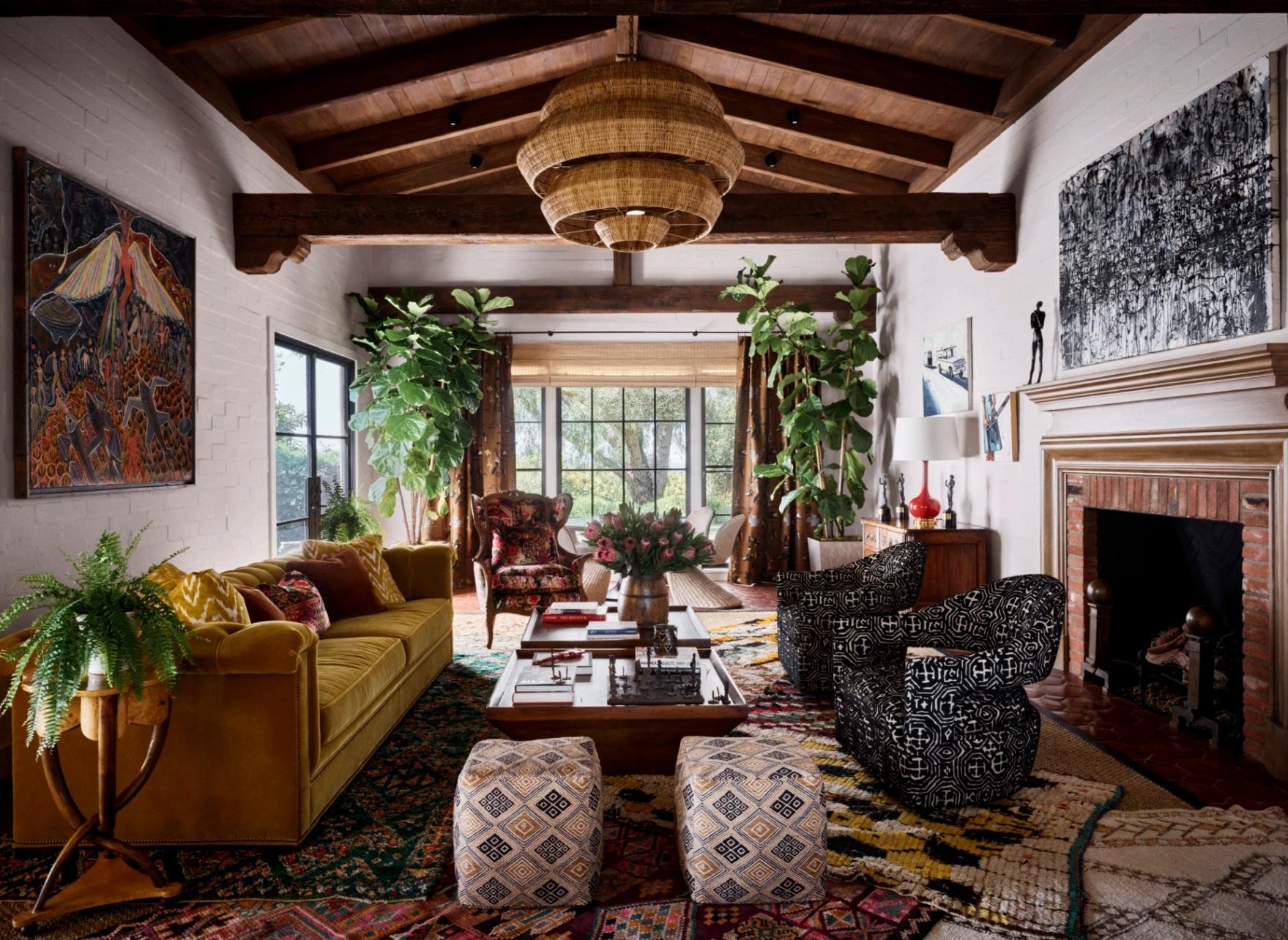 Eclectic living room with mustard velvet sofa, wood-beam ceiling, fiddle-leaf figs, and layered vintage rugs, Central Coast, California, by Tammy Randall Wood / Interior Archaeology