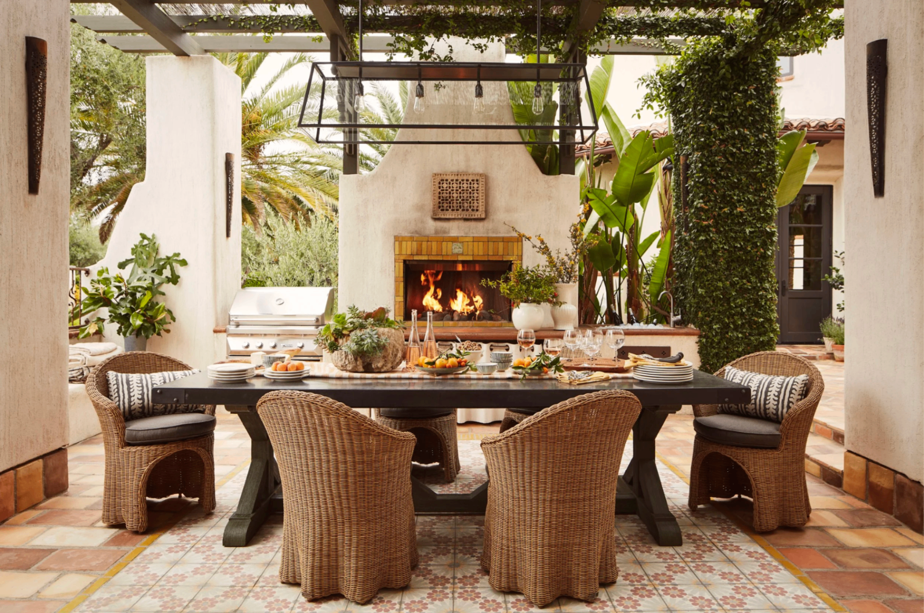 Kanan Round One — covered outdoor dining patio with fireplace and pergola, Malibu, California, by Tammy Randall Wood / Interior Archaeology