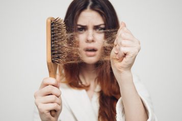 Girl,With,A,Comb,And,Problem,Hair,On,White,Background