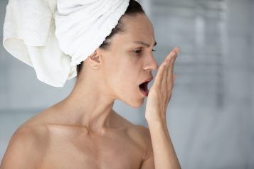 Woman,With,Towel,On,Head,Put,Palm,In,Front,Face